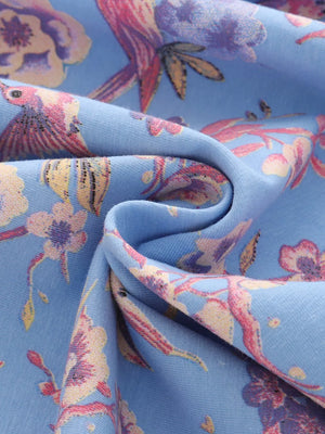 Baby dress in blue cotton blend with floral hummingbird print