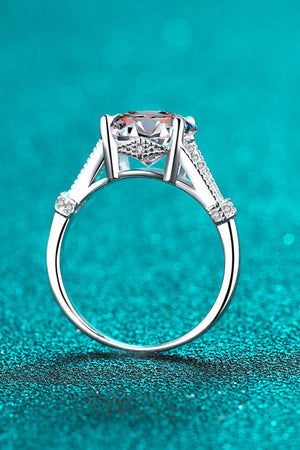 Silver pavé-set moissanite solitaire ring with 925 sterling silver band.