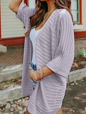 Textured ribbed sleeve cardigan in light purple with open front and elbow-length sleeves.