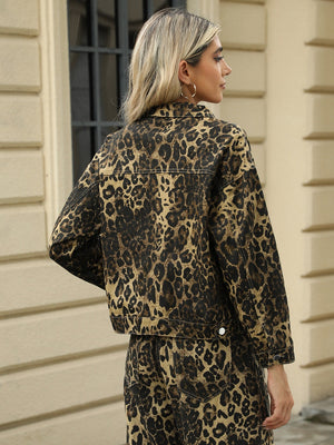 Leopard print denim jacket with button closure and collar.