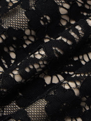 Black lace mini dress detail with spaghetti straps and floral pattern