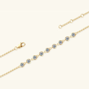 Gold bezel-set moissanite tennis bracelet with adjustable clasp