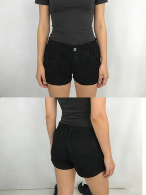 Black cargo shorts with button fly and elastic waistband, featuring side pockets.