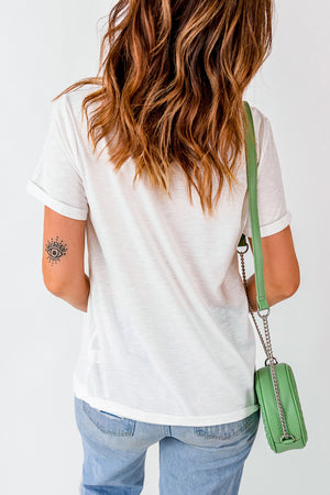 White casual tee with rolled sleeves and a bold graphic detail on the arm.