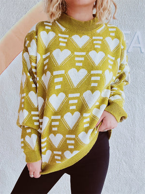Mustard geometric heart jacquard knit jumper with mock neck and long sleeves.
