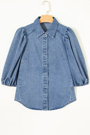 Denim maternity blouse with voluminous puff sleeves, collared neckline, and button-down front.