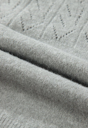 Gray lace-effect knit cardigan with a textured stitch pattern and button-down front.