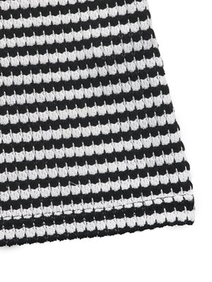 Black and white striped bustier romper with textured knit fabric