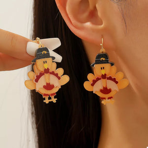 Thanksgiving turkey charm dangle earrings in acrylic and alloy, featuring pilgrim hats.