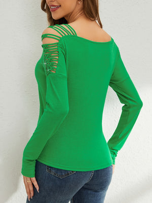 Green ribbed knit blouse with strappy cold shoulder and embellished sleeve detail.