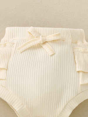 Cream ribbed baby bloomers with ruffle trim and a bow detail