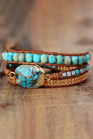 Turquoise and copper wrap bracelet set with leather, stone and metal beads.