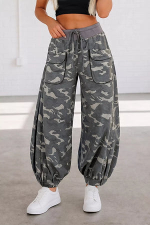 Camouflage barrel pants with cargo pockets and drawstring waist.