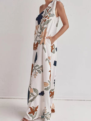 Elegant one-shoulder maxi dress with a floral print and tie detail.