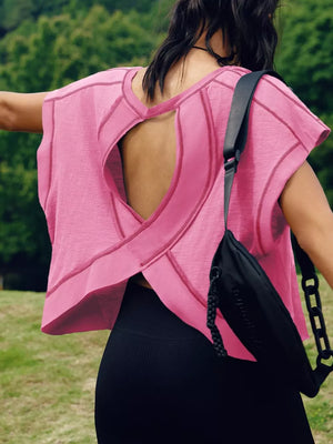 Pink t-shirt with exposed seams and crisscross cutout back detail