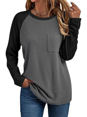 Pocketed round neck long sleeve t-shirt with contrasting black sleeves and gray body.