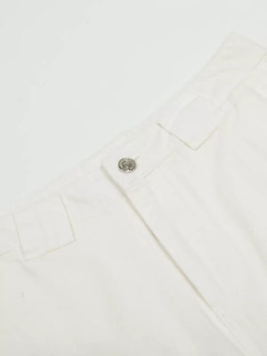 White men's capris with wide legs, a button closure, and belt loops.