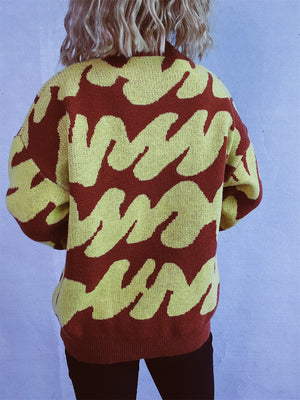 Graphic Wave Knit Sweater in Dark Brown and Light Yellow, featuring a bold abstract pattern.