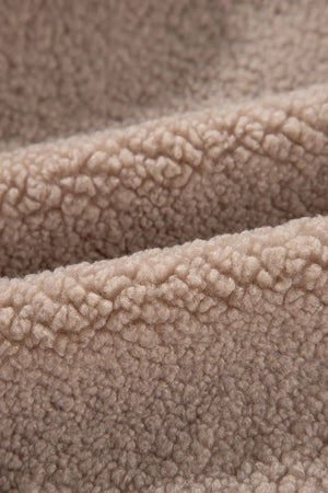 Teddy bomber jacket in mocha showing fluffy sherpa fabric texture.