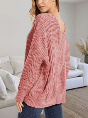 Dusty Pink ribbed knit sweater with batwing sleeves and a wide neckline.