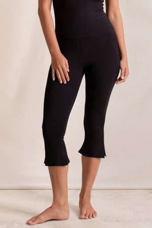Black flared hem crop leggings with a ruffled hem detail.