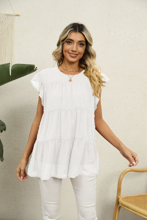 White Swiss dot tiered flutter sleeve blouse with ruffled neckline