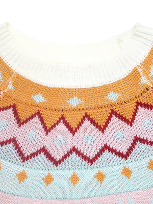 Geometric knit sweater in white with colorful chevron and diamond patterns.
