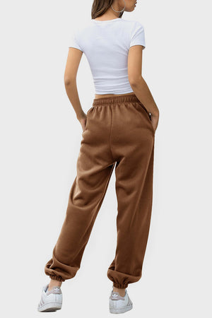 Relaxed-fit cuffed sweatpants in coffee brown with elastic waistband and pockets.