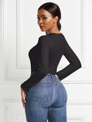 Black long sleeve ribbed bodysuit with a body-hugging fit.
