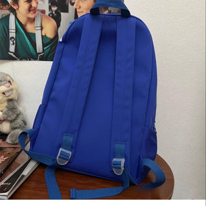 Klein Blue nylon medium backpack with adjustable straps and utility pocket detail.