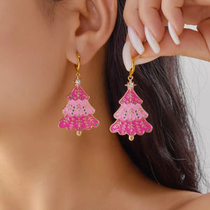 Christmas tree dangle earrings in blush pink with festive green accents and a star topper.