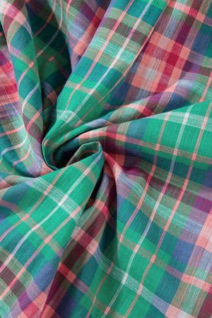 Voluminous plaid blouse fabric with green, pink, and blue checks.