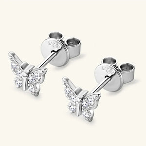 Silver moissanite butterfly stud earrings with clear stones.