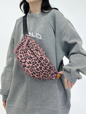 Dusty Pink leopard print pleated sling bag with a braided drawstring detail.