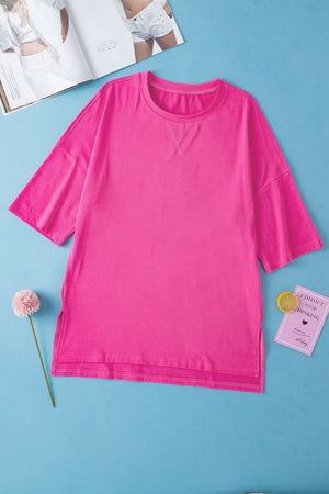 Pink boxy cotton t-shirt with crew neck and shoulder stitch detail.
