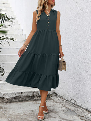 Dark green button-down sleeveless midi dress with tiered skirt and ruffled hem.