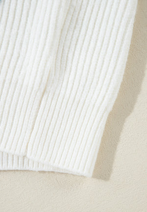 White ribbed knit sweater with subtle heart embellishment detail