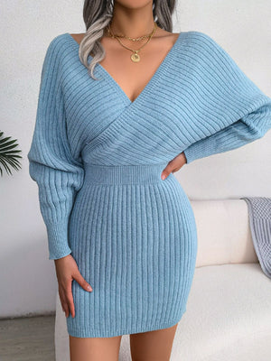 Sky blue acrylic wrap knit bodycon mini dress with long sleeves and a deep V-neck.
