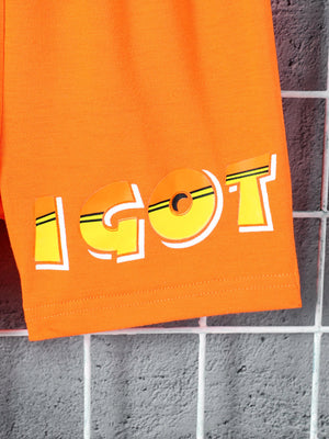 Orange boys' shorts with a bold yellow and white "IGOT" graphic print.
