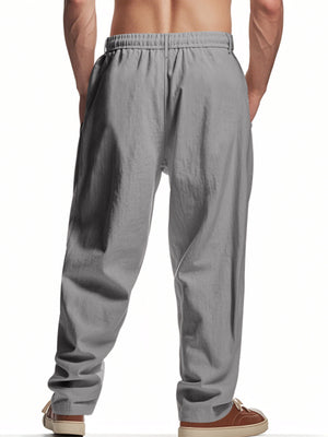 Men's grey loose fit sweatpants with drawstring waist and pockets.