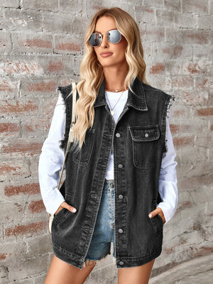 Black denim utility vest with raw edges, button front, and chest pockets.