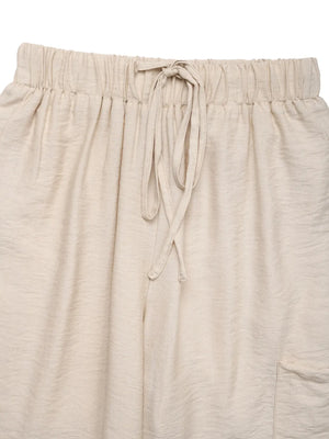 Chic waist-tie flare trousers in tan with a drawstring waist and textured fabric.