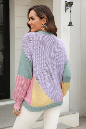 Colorblock knit sweater with sculpted sleeves in pastel lavender, mint green, pink, and yellow acrylic.