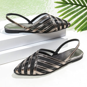 Chic mesh pointed slingback flats in black with metallic gold straps.