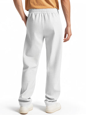 White textured drawstring sweatpants for men with a casual fit.