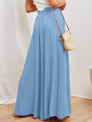 Light blue textured drawstring palazzo trousers with a wide leg and pockets.