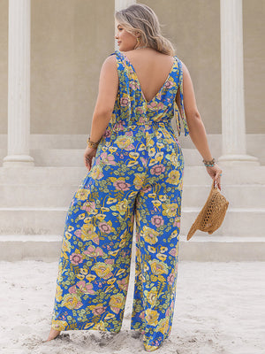 Blue floral tie-shoulder wide-leg jumpsuit with a V-neck back and cinched waist.
