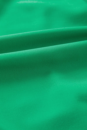 Green maxi dress fabric detail with soft folds