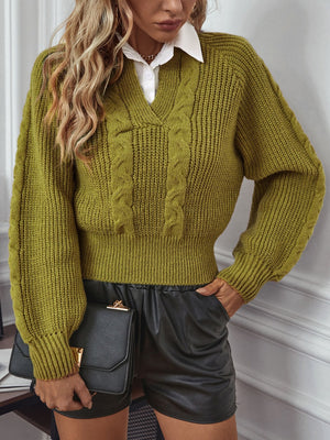 Matcha green cable knit sweater with V-neck and blouson sleeves.