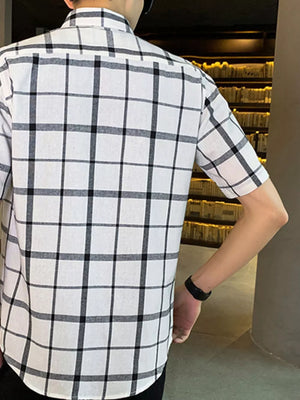Men's white plaid short sleeve button-down shirt with chest pocket.